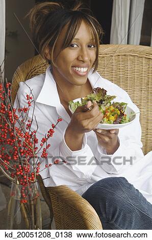 African American woman eating salad View Large Photo Image Stock Photo - African American woman eating salad. Fotosearch