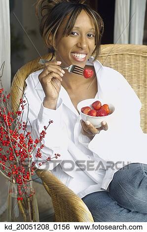 African American woman eating strawberries View Large Photo Image Stock Photograph - African American woman eating strawberries. Fotosearch