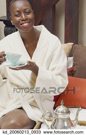 African American woman in bathrobe drinking tea View Large Photo Image Stock Image - African American woman in bathrobe drinking tea. Fotosearch