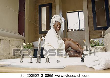 African American woman in bathroom wearing bathrobe View Large Photo Image Stock Photography - African American woman in bathroom wearing bathrobe. Fotosearch