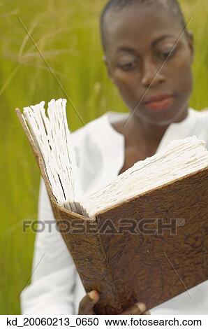 African American woman reading book outdoors View Large Photo Image Stock Image - African American woman reading book outdoors. Fotosearch
