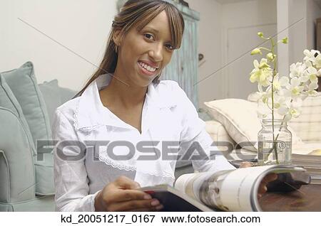 African American woman reading magazine View Large Photo Image Stock Photo - African American woman reading magazine. Fotosearch