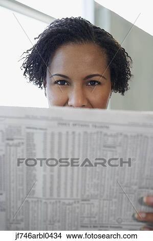African American woman reading newspaper View Large Photo Image Picture - African American woman reading newspaper. Fotosearch