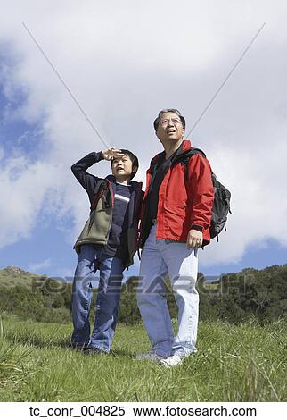 Stock Photography - Asian father and son outdoors. Fotosearch