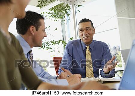 Stock Photo - Businesspeople in a meeting. Fotosearch