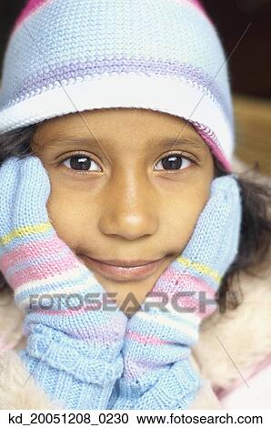 Close up of girl wearing mittens and hat View Large Photo Image Stock Image - Close up of girl wearing mittens and hat. Fotosearch