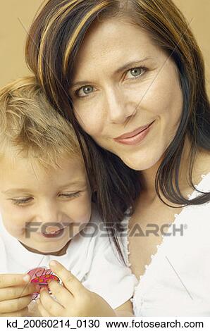 Close up of mother and young son View Large Photo Image Stock Image - Close up of mother and young son. Fotosearch