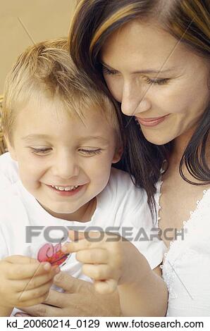 Stock Photo - Close up of mother and young son. Fotosearch