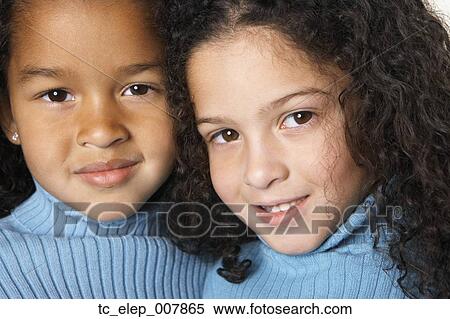 Stock Photography - Close up of two young girls. Fotosearch