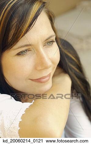 Stock Image - Close up of woman smiling. Fotosearch