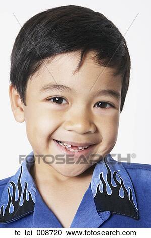Stock Image - Close up of young boy smiling. Fotosearch