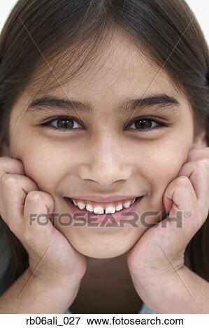 Close up of young girl smiling View Large Photo Image Stock Photo - Close up of young girl smiling. Fotosearch