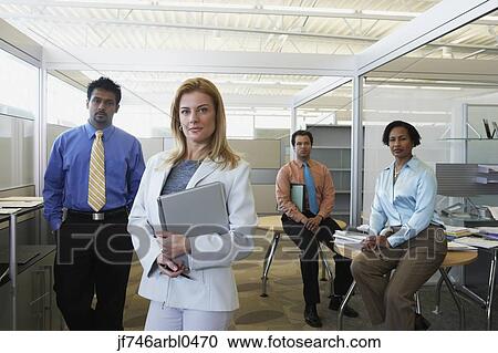 Stock Image - Group of businesspeople in office. Fotosearch