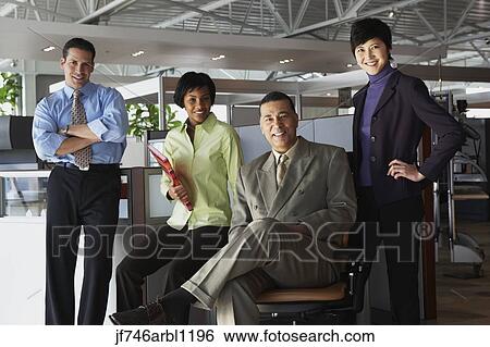 Group of businesspeople in office View Large Photo Image Stock Photograph - Group of businesspeople in office. Fotosearch