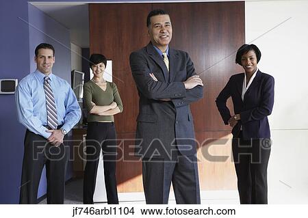 Group of businesspeople smiling in office View Large Photo Image Picture - Group of businesspeople smiling in office. Fotosearch