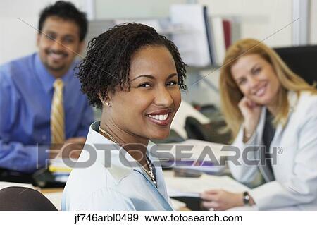 Stock Photo - Group of coworkers in office. Fotosearch