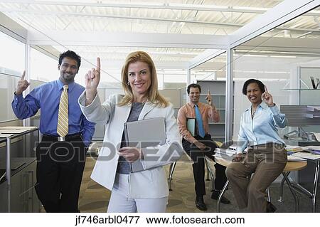 Stock Photo - Group of coworkers making the Number One hand gesture. Fotosearch
