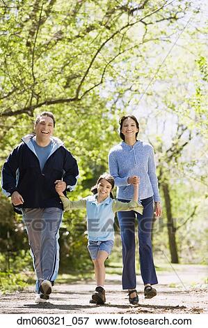 Hispanic family walking outdoors View Large Photo Image Stock Photo - Hispanic family walking outdoors. Fotosearch