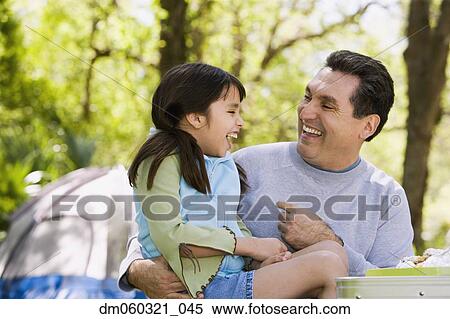 Hispanic father and daughter laughing outdoors View Large Photo Image Stock Photography - Hispanic father and daughter laughing outdoors. Fotosearch