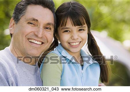 Hispanic father and daughter smiling View Large Photo Image Stock Image - Hispanic father and daughter smiling. Fotosearch