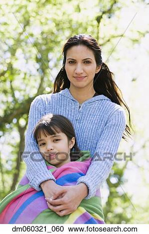 Hispanic mother and daughter hugging outdoors View Large Photo Image Stock Image - Hispanic mother and daughter hugging outdoors. Fotosearch