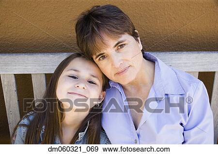 Hispanic mother and daughter hugging View Large Photo Image Stock Photo - Hispanic mother and daughter hugging . Fotosearch