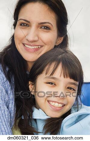 Hispanic mother and daughter smiling View Large Photo Image Stock Photograph - Hispanic mother and daughter smiling. Fotosearch