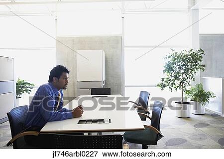 Indian businessman at desk View Large Photo Image Stock Photo - Indian businessman at desk. Fotosearch