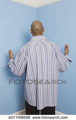 Rear view of African American man facing corner View Large Photo Image Stock Photograph - Rear view of African American man facing corner. Fotosearch