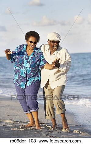 Senior African American couple dancing on beach View Large Photo Image Stock Photo - Senior African American couple dancing on beach. Fotosearch