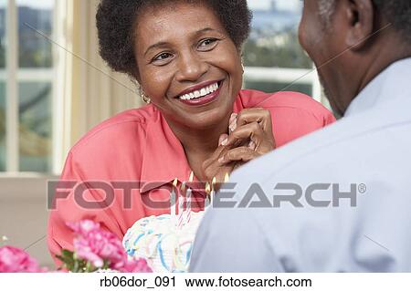Senior African American couple with birthday cake View Large Photo Image Stock Image - Senior African American couple with birthday cake. Fotosearch