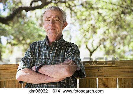 Senior Hispanic man smiling outdoors View Large Photo Image Picture - Senior Hispanic man smiling outdoors. Fotosearch