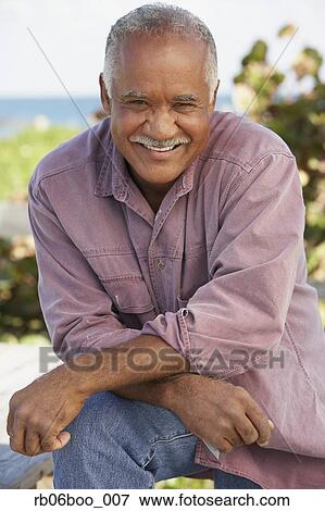 Senior man laughing outdoors View Large Photo Image Stock Photo - Senior man laughing outdoors. Fotosearch