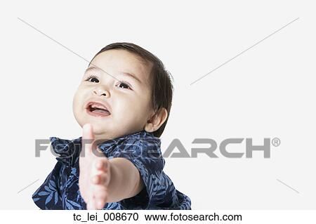 Studio shot of toddler boy reaching View Large Photo Image Stock Image - Studio shot of toddler boy reaching. Fotosearch