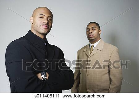 Studio shot of two African American businessmen View Large Photo Image Stock Image - Studio shot of two African American businessmen. Fotosearch