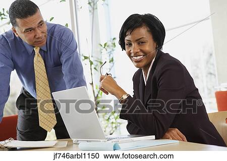 Two African American businesspeople in office View Large Photo Image Stock Image - Two African American businesspeople in office. Fotosearch