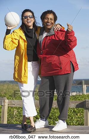 Two middle-aged women with volley ball View Large Photo Image Stock Photo - Two middle-aged women with volley ball. Fotosearch