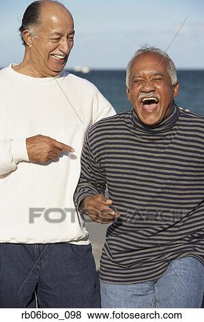 Two senior men laughing outdoors View Large Photo Image Stock Photo - Two senior men laughing outdoors. Fotosearch