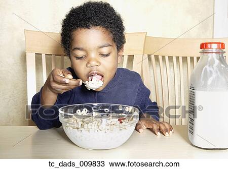 Young African American boy eating cereal View Large Photo Image Stock Image - Young African American boy eating cereal. Fotosearch