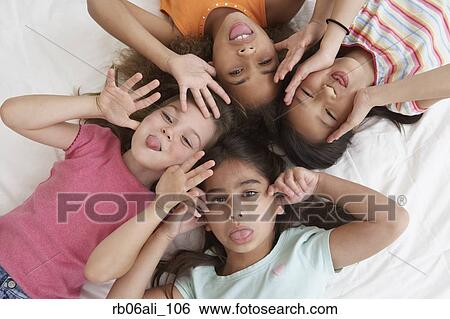 Young girls being silly View Large Photo Image Stock Photograph - Young girls being silly. Fotosearch
