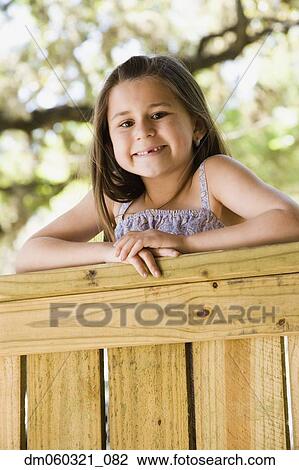 Young Hispanic girl smiling outdoors View Large Photo Image Stock Image - Young Hispanic girl smiling outdoors. Fotosearch