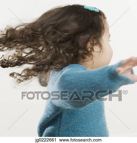 Young Hispanic girl spinning around View Large Photo Image Stock Image - Young Hispanic girl spinning around. Fotosearch