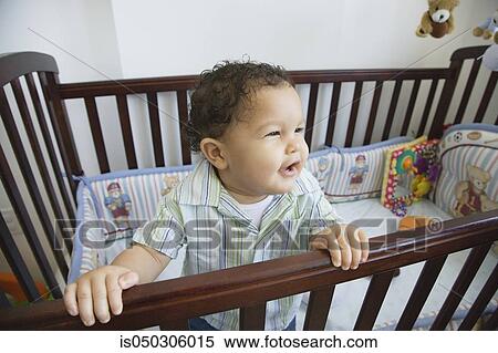 African baby in standing crib View Large Photo Image Stock Photography - African baby in standing crib. Fotosearch