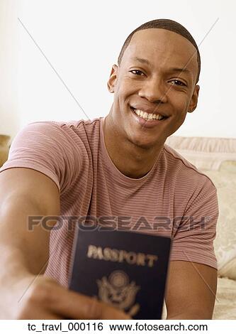 African man holding out passport View Large Photo Image Stock Photograph - African man holding out passport. Fotosearch