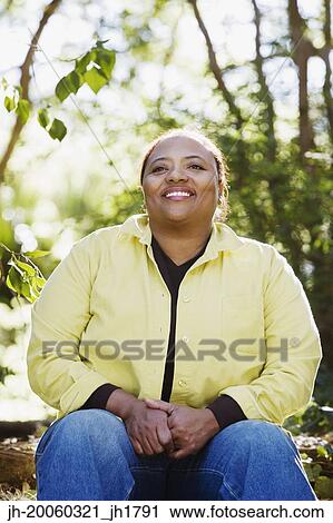 African woman smiling in woods View Large Photo Image Stock Image - African woman smiling in woods. Fotosearch