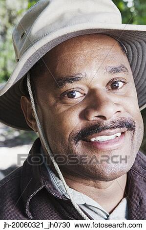 Close up of African man wearing hat View Large Photo Image Stock Image - Close up of African man wearing hat. Fotosearch