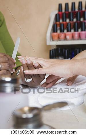 Close up of woman receiving manicure View Large Photo Image Stock Image - Close up of woman receiving manicure. Fotosearch
