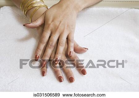 Stock Photo - Close up of womanís hands with fresh manicure. Fotosearch