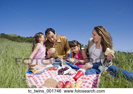 Hispanic family having picnic View Large Photo Image Stock Photograph - Hispanic family having picnic. Fotosearch