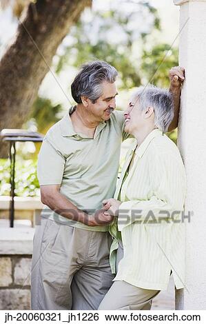 Middle-aged couple holding hands View Large Photo Image Stock Photograph - Middle-aged couple holding hands. Fotosearch